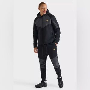 Nike Men’s Black Joggers with Gray Knee Panels & Yellow Swoosh